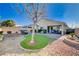 Landscaped backyard with artificial turf, hot tub and patio at 2452 Blair Castle St, Henderson, NV 89044