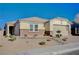 Single-story home with neutral exterior, stone accents, and landscaped front yard at 2452 Blair Castle St, Henderson, NV 89044