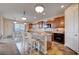 Island kitchen with granite counters and stainless steel appliances at 2452 Blair Castle St, Henderson, NV 89044