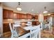 Eat-in kitchen with granite countertops and farmhouse table at 2452 Blair Castle St, Henderson, NV 89044