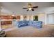 Open concept living room with kitchen and large sectional sofa at 2452 Blair Castle St, Henderson, NV 89044