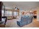 Spacious living room with a large sectional sofa and open kitchen at 2452 Blair Castle St, Henderson, NV 89044
