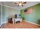 Home office features wood floors and a ceiling fan at 2452 Blair Castle St, Henderson, NV 89044