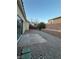 Backyard features a stone patio, gravel landscaping, and partial brick wall, perfect for outdoor relaxation at 2536 Grand Basin Dr, Las Vegas, NV 89156