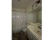 Functional bathroom features a tub/shower combination, white vanity, and tiled flooring for easy maintenance at 2536 Grand Basin Dr, Las Vegas, NV 89156