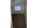 A cozy bedroom with a window providing natural light and neutral walls, awaiting personalization at 2536 Grand Basin Dr, Las Vegas, NV 89156
