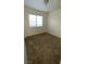 Neutral bedroom featuring a large window and comfortable carpeting at 2536 Grand Basin Dr, Las Vegas, NV 89156