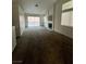 Spacious living room featuring plush carpeting, fireplace, and sliding glass doors at 2536 Grand Basin Dr, Las Vegas, NV 89156
