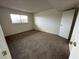 Bright bedroom with neutral carpeting and a window with a view at 585 S Royal Crest Cir # 21, Las Vegas, NV 89169