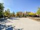 Basketball court in a well-maintained community with residential homes and mature trees at 6216 Pangea Ave, Las Vegas, NV 89139