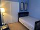 Bedroom featuring a dark bed frame, neutral carpet, and a functional layout, offering a peaceful retreat at 6216 Pangea Ave, Las Vegas, NV 89139