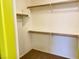 An ample walk-in closet with neutral walls and carpet, designed for clothing and accessories at 6216 Pangea Ave, Las Vegas, NV 89139