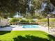Relax in this community pool area, landscaped and shaded with plenty of seating around the pool at 6216 Pangea Ave, Las Vegas, NV 89139