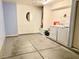 The garage area includes laundry hookups and ample space for a vehicle, workbench, and storage at 6216 Pangea Ave, Las Vegas, NV 89139
