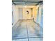 Clean and well-lit garage, with washer and dryer, providing ample space for parking and storage solutions at 6216 Pangea Ave, Las Vegas, NV 89139