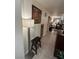 Hallway with tile floor, view to living room, and view to dining room at 6216 Pangea Ave, Las Vegas, NV 89139