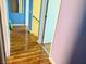 Hallway with wood-look flooring connecting rooms of the home on the upper level at 6216 Pangea Ave, Las Vegas, NV 89139