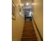 Staircase with wood steps leading to the upper level and a handrail on the right side at 6216 Pangea Ave, Las Vegas, NV 89139