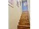 Staircase with wood steps leading to the upper level and a handrail on the right side at 6216 Pangea Ave, Las Vegas, NV 89139