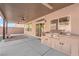 Covered patio with built-in grill and artificial turf at 6360 Stag Hollow Ct, Las Vegas, NV 89139
