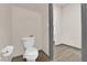 Clean and modern bathroom with toilet and access to another room at 6360 Stag Hollow Ct, Las Vegas, NV 89139
