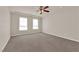 Bright and airy bedroom with two windows and ceiling fan at 6360 Stag Hollow Ct, Las Vegas, NV 89139