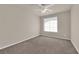 Bright bedroom featuring a ceiling fan and large window at 6360 Stag Hollow Ct, Las Vegas, NV 89139