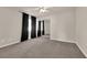 Spacious bedroom with mirrored closet doors and neutral decor at 6360 Stag Hollow Ct, Las Vegas, NV 89139