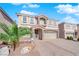 Two-story house with stone accents and a three-car garage at 6360 Stag Hollow Ct, Las Vegas, NV 89139