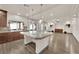 Open concept kitchen with large island and living area views at 6360 Stag Hollow Ct, Las Vegas, NV 89139