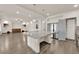 Open concept kitchen with island and views into living area at 6360 Stag Hollow Ct, Las Vegas, NV 89139