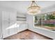 Bright dining room with hardwood floors and a large window at 9809 La Vid Ct, Las Vegas, NV 89117