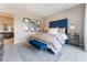 Spacious bedroom with a blue upholstered headboard and en-suite bathroom at 10325 Jade Point Dr, Las Vegas, NV 89135