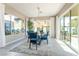 Sunlit dining room with sliding glass doors leading to a patio at 10325 Jade Point Dr, Las Vegas, NV 89135