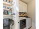 Convenient laundry room with washer, dryer, and additional storage at 149 Attingham Park Ave, Henderson, NV 89002