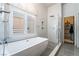 Bright bathroom featuring a soaking tub, glass shower, and natural light at 2144 Paganini Ave, Henderson, NV 89052