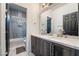 Modern bathroom features a double vanity and shower-tub combo at 2144 Paganini Ave, Henderson, NV 89052