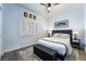 Comfortable bedroom with a queen size bed, wood-style floor, and neutral color palette at 2144 Paganini Ave, Henderson, NV 89052