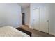 Bedroom features a closet with sliding doors and a doorway with a contrasting black door at 2144 Paganini Ave, Henderson, NV 89052