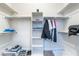 Walk-in closet with built-in shelving, hanging racks, and ample storage space at 2144 Paganini Ave, Henderson, NV 89052