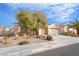 Well-maintained single-story home featuring desert landscaping, a wide driveway, and a two-car garage at 2144 Paganini Ave, Henderson, NV 89052