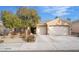 Inviting home featuring a neutral exterior, a well-kept front yard, and a two-car garage with ample parking space at 2144 Paganini Ave, Henderson, NV 89052