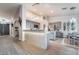 Modern kitchen featuring a large island with pendant lighting, stainless steel appliances, and stylish gray cabinetry at 2144 Paganini Ave, Henderson, NV 89052