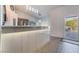 Bright kitchen with a spacious countertop, stainless steel appliances, and a sliding door to the backyard at 2144 Paganini Ave, Henderson, NV 89052