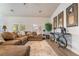 Cozy living room showcasing a comfortable sectional sofa, stylish decor, and ample natural light from the windows at 2144 Paganini Ave, Henderson, NV 89052