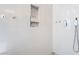 Modern shower with tile accent wall, rainfall shower head, and glass enclosure at 2144 Paganini Ave, Henderson, NV 89052