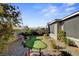 This backyard features a unique putting green, stone accents, and well-maintained landscaping at 2395 Dalewood Ave, North Las Vegas, NV 89086