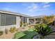 This backyard boasts low-maintenance desert landscaping and has a putting green at 2395 Dalewood Ave, North Las Vegas, NV 89086