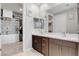 Double vanity bathroom with large mirror and walk-in closet at 2395 Dalewood Ave, North Las Vegas, NV 89086