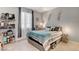 Cozy bedroom showcasing decor, comfortable bed with storage, and a bright window with modern curtains at 2395 Dalewood Ave, North Las Vegas, NV 89086